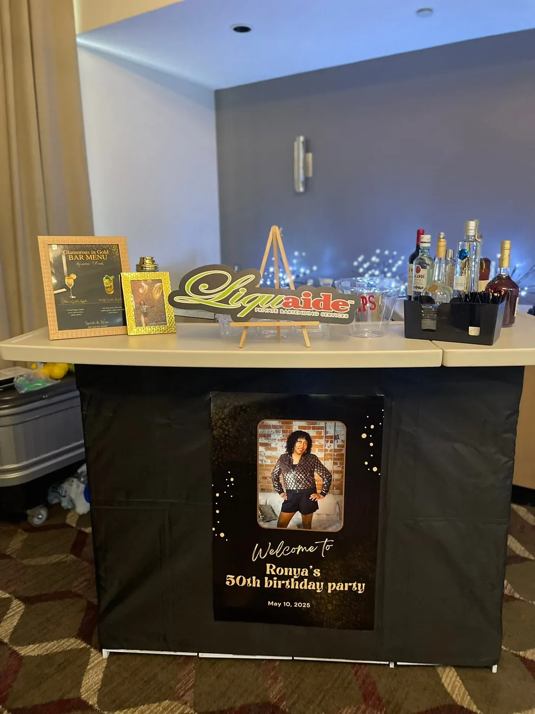 Liquaide bar setup with a full liquor spread at a private birthday celebration