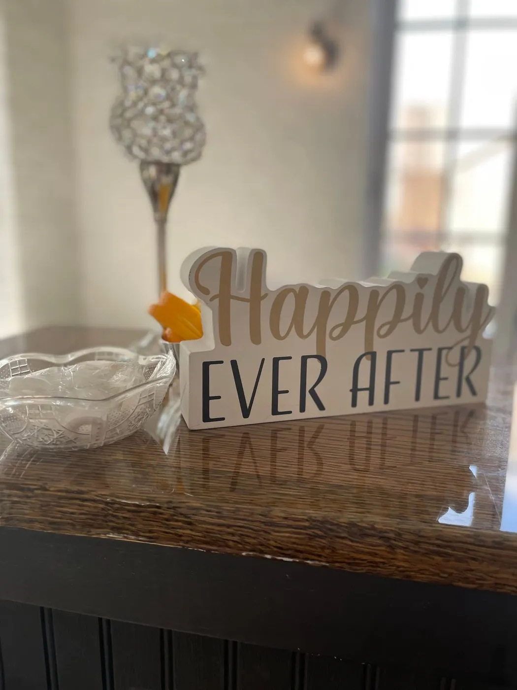 "Happily Ever After" bar signage styled with crystal glassware for a wedding